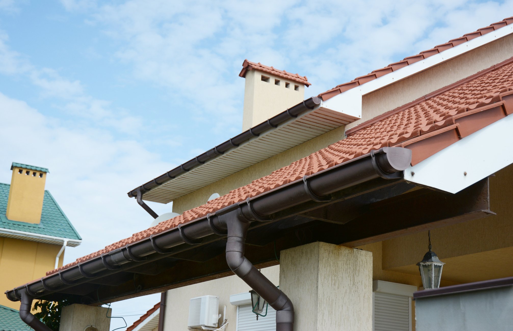 Close up view on House Roof Areas for Rain Gutter Waterproofing Outdoor. Home Guttering, Gutters, Plastic Guttering System, Guttering & Drainage Pipe Exterior