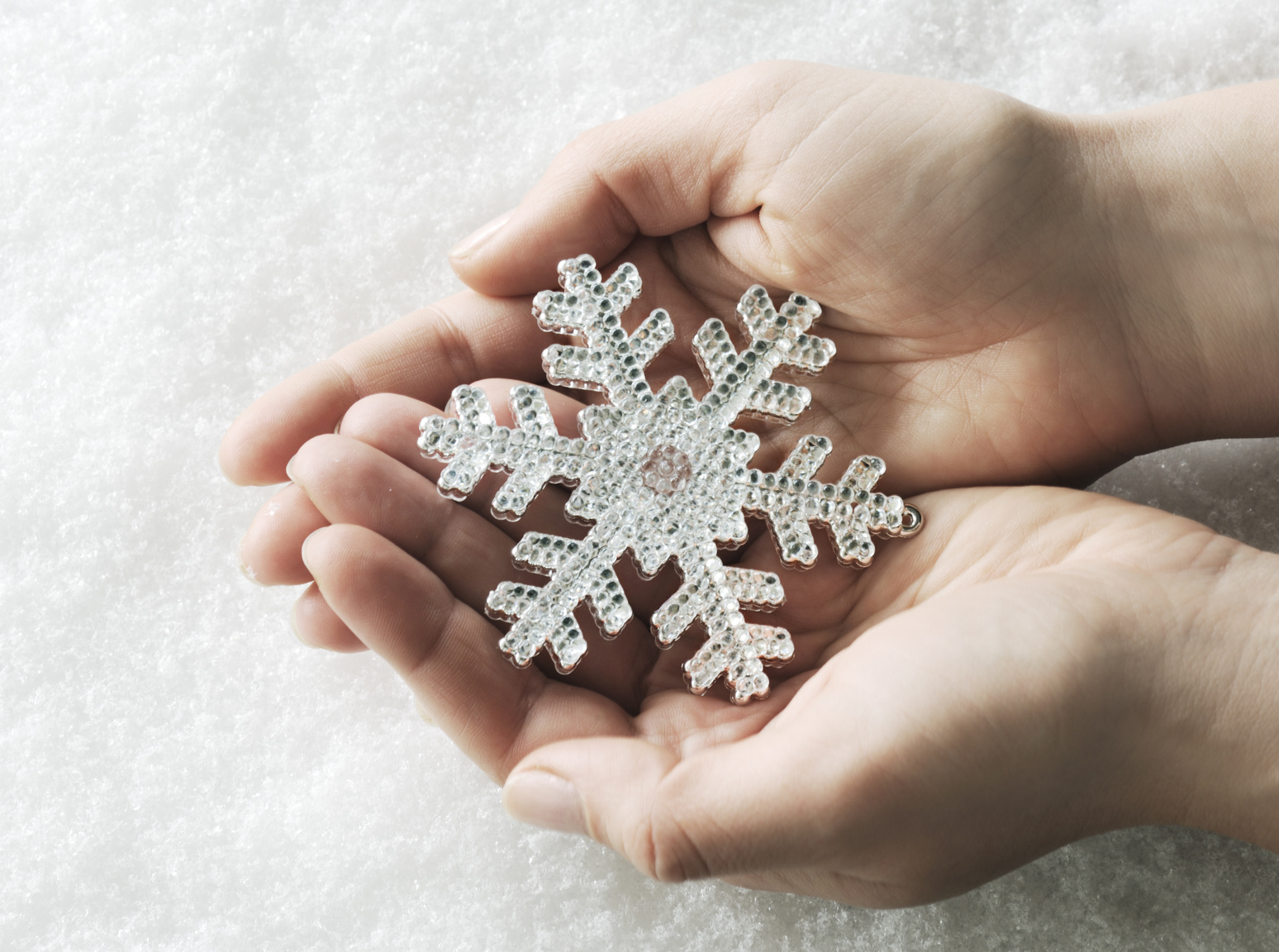 Hands with snowflake